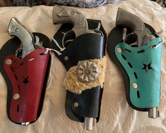 1960's era cap guns in holsters