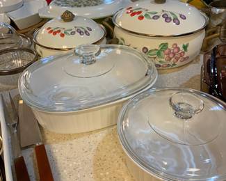 French White casseroles and vintage pots and pans with brass handles