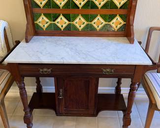 Antique washstand with marble top and tile backboard
