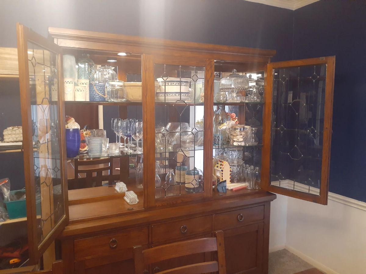 China Cabinet with Lighted Display area. Excellent Condition!
This cabinet overall is: 68-3/4" wide, 18-1/4" deep and 81-1/2" tall.
The top glass lighted display comes apart from the cabinet base for easy moving.