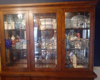 China Cabinet with Lighted Display area. Excellent Condition!
This cabinet overall is: 68-3/4" wide, 18-1/4" deep and 81-1/2" tall.
The top glass lighted display comes apart from the cabinet base for easy moving.