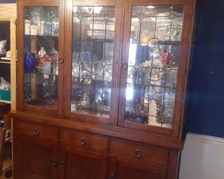 China Cabinet with Lighted Display area. Excellent Condition!
This cabinet overall is: 68-3/4" wide, 18-1/4" deep and 81-1/2" tall.
The top glass lighted display comes apart from the cabinet base for easy moving.
