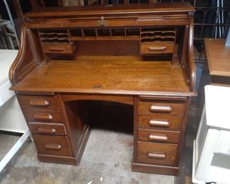 Oak Roll Top Desk with locking key.
This desk is solid and heavy. Has casters for easy rolling around. Great useable accent piece.
Overall 48" wide, 26-1/2" deep and 46' tall. Writing surface is 30-3/4' from floor.