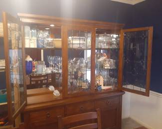 China Cabinet with Lighted Display area. Excellent Condition!
This cabinet overall is: 68-3/4" wide, 18-1/4" deep and 81-1/2" tall.
The top glass lighted display comes apart from the cabinet base for easy moving.