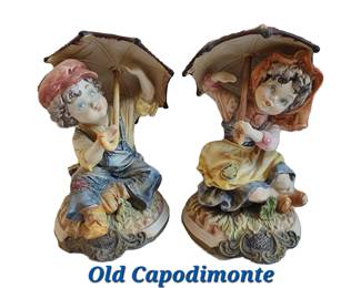 Old Capodimonte large figurines-  boy and girl under umbrellas.