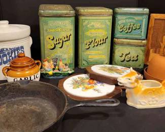 Vintage Kitchen Canisters, Trivets, Cast Iron Pan, And More
