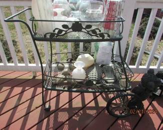 serving cart , tree faces, vases