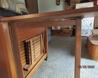 side view of the stowed away chairs (Romanian gate leg table)
