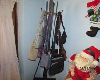 purses and wooden coat rack