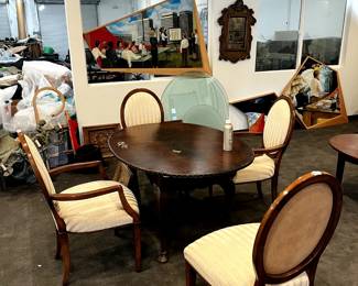 set of four dining chairs with striped fabric seats and backing, table with leather top