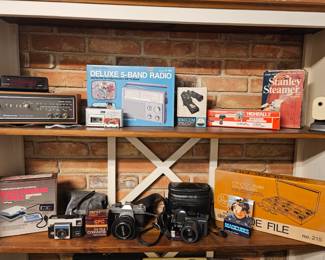 Vintage Cameras and equipment
Canon Camera 
5-Band Radio
Blood pressure machine 
