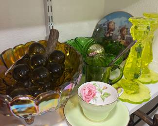 More mcm glass grapes.  I love these for the coffee table. Aynsley cup and saucer.  Uranium glass candlesticks. Emerald green cut glass bowl, vintage needle case, Amber Carnival glass .