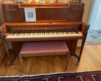 . . . a Steinway mahogany upright piano with bench