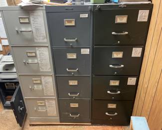 . . . three four-drawer file cabinets