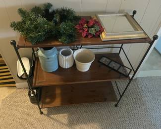 Three-tiered metal shelf stand.