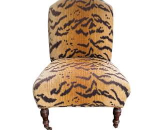 Tiger upholstered slipper chair with wooden casters