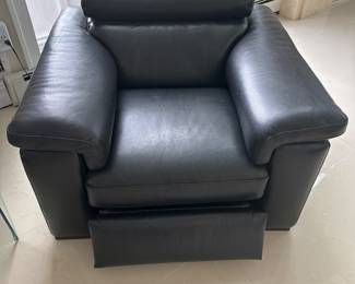 Natuzzi Black Leather Chair with power, headrest and power recline. 