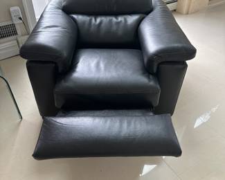 Natuzzi Black Leather Chair with power, headrest and power recline. 