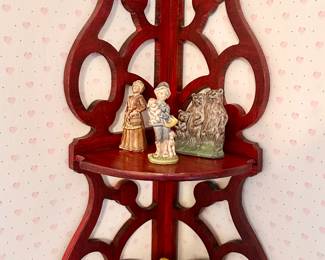 Corner decorative shelf.
