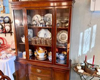 Vintage china cabinet filled with treasures.