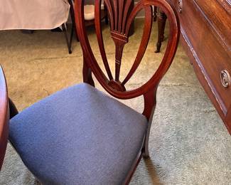 One of 4 dining chairs.