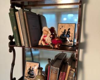 Cute antique mirrored shelf filled with vintage goodies.