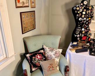 Armchair & needlework pillows.
