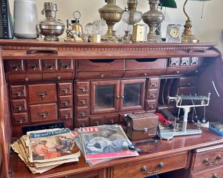 Large rolltop desk, Aladdin lamps, vintage magazines