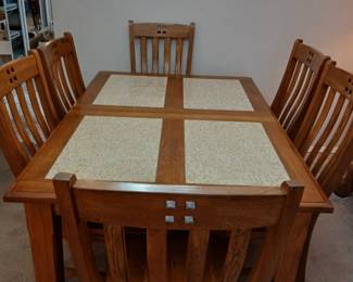 Wood and granite dining room table with 6 chairs