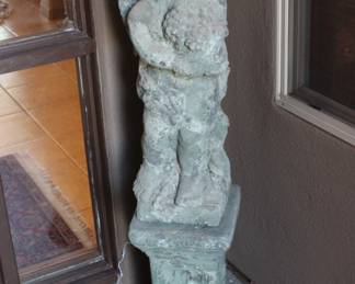 Concrete statue in front of the house