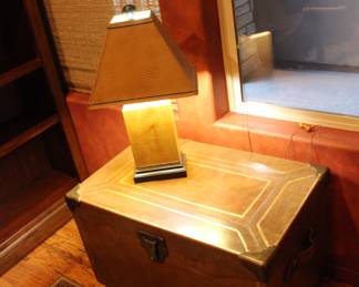 The wood and leather wrapped chest is for sale - as well as the lamp!
