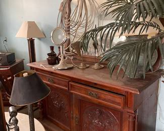 Carved wooden antique buffet & mirror . Brass flamingos