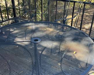 Wrought iron patio table with four chairs