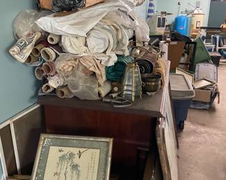 Bolts of fabric, antique frames