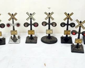 1211 GROUP OF ASSORTED TRAIN O GAUGE METAL CROSSING SIGNALS