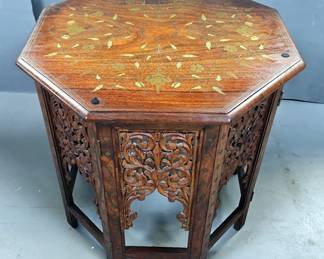 Antique Octagonal Inlaid Teak Anglo-Indian Occasional Table, Folding Fretwork Design Base, Top Is Inlaid With Brass Floral Bouquets And Trailing Vines, A Few Of The Inlays Are Copper, Sides Have Mogul Arches, 22.5" x 22" Diameter