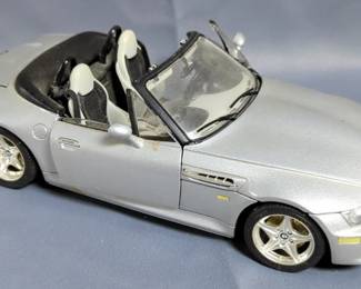 Radio Shack RC 4x4 Off Roader, Bburago BMW M Roadster Diecast Car, And WT Car Garage Die Cast Model Tools