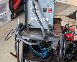 Chicago Electric Welding Systems Mig Welder With Thermal Overload, Model Mig-100, Chicago Electric Metal Rolling Welder Cart, Model 60790, 28" x 15" x 26", Includes Western Safety Auto Darkening Helmet, Magnets, And More, Welder Powers On