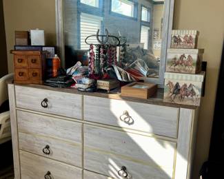 Dresser with mirror, jewelry, and jewelry boxes