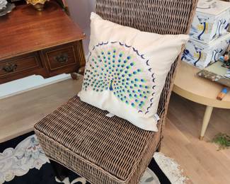 Peacock Pillow and Wicker Accent Chair