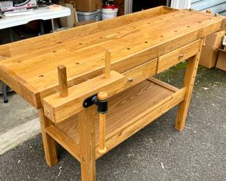 Beautiful Mid-Century Woodworking Table with handsome wood grains,  built in vises and green felt-lined drawers.