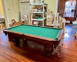 Pool Table includes cue sticks, balls and rack.