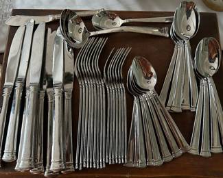 Lenox “Eternal” stainless flatware. Service for 8 minus one salad fork and plus 1 Tbl, 1 dinner fork, ladle, butter knife and sugar spoon. 44 pcs