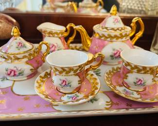 Lovely Intricate Tea Set
   Teapot, Sugar Bowl, Creamer and 
   (2) Cups & Saucers in addition to
   Serving Platter