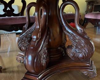 Close Up of Carved Swan Pedestal 
On Dining Table 