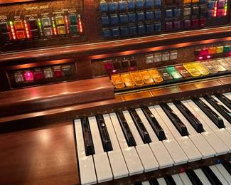 This outstanding  Lowrey organ has such amazing sound!  Receipt shows the cost of $55,000 in 1998. Yes, you read correctly- 55 THOUSAND dollars! Lowrey Promenade X400 with walnut finish 