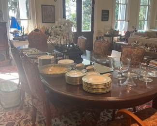 Dining table is oval with ball and claw feet and 4 leaves purchased in New Orleans - seats 12