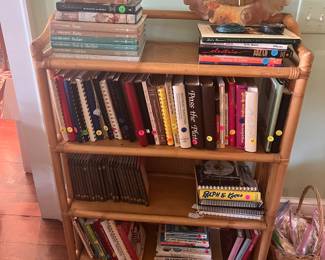 Rattan bookcase, regional cookbooks