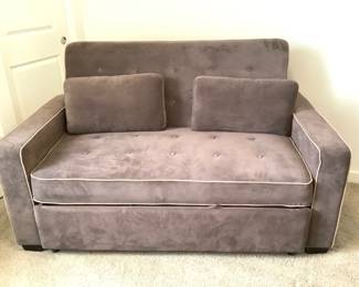 RUVE203 LifeStyle Solutions Serta Convertible Sleeper Sofa Made by Lifestyle Solutions is this Serta convertible sleeper sofa. Chocolate like color made out of microfiber. Come with to throw pillows. Looks to fold out to a full size bed.
