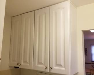 White laundry room cabinets